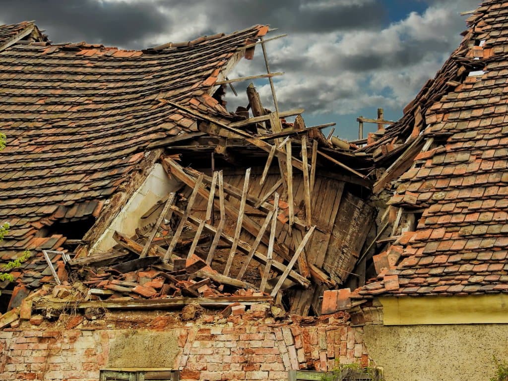 Collapsed roof structure documented as part of a disputed catastrophe insurance claim