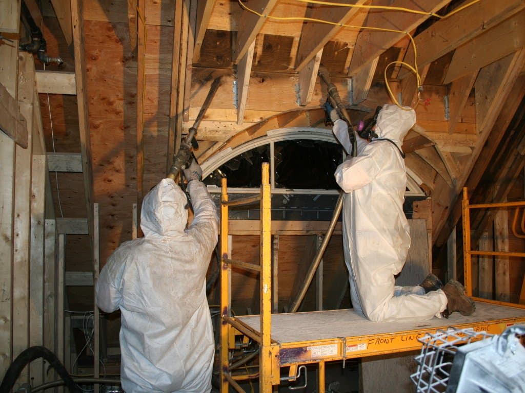 Fire-damaged interior with destroyed contents being assessed for an insurance claim