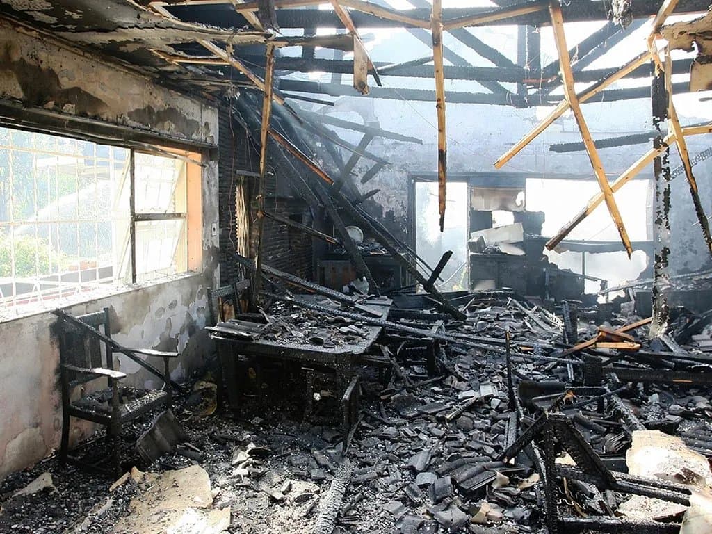 Fire-damaged property being assessed and documented for an insurance claim