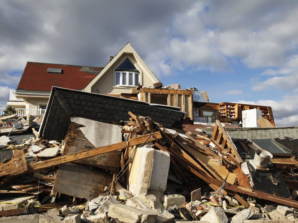 Coastal home reduced to debris after storm surge destroyed the structure